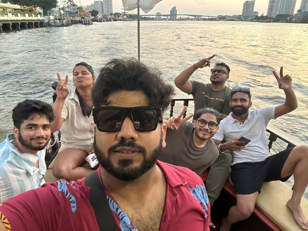 Boat trip at sunset with friends